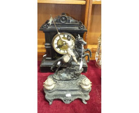 An ebonised wood mantel clock with gong-striking movement, 38cm high and a Joan of Arc painted metal inkstand, (2).