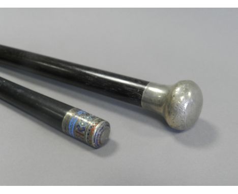 A Russian silver and enamel mounted cane together with a further silver mounted cane