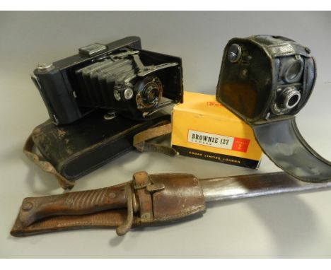 A group of early to mid 20th century roll film cameras including an Ensignette Deluxe No. 2 together with a bayonet in steel 