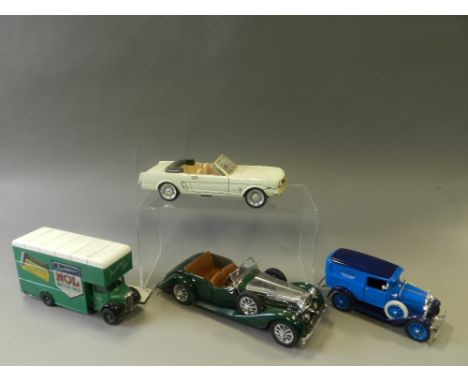 A quantity of unboxed die cast model cars in various scales to include vans, sports cars, farm vehicles and military tanks, m