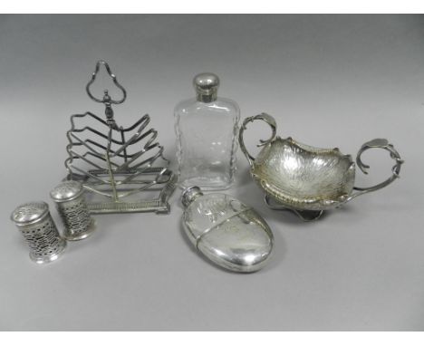 A quantity of electro plated wares to include oval serving dish and cover, toast racks, condiments, tongs, hip flask dated 18