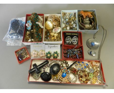 A large quantity of costume jewellery, to include; a jet crucifix pendant, silver brooches, chain and bead necklaces etc