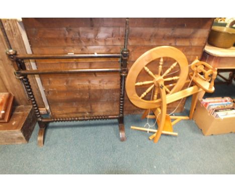 An adjustable stained frame tapestry frame and a modern pine spinning wheel and two boxes of hardback books on needlework and