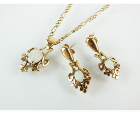 A 9ct gold opal doublet pendant, suspended from 9ct gold chain, together with a pair of opal set ear pendants, total weight 9