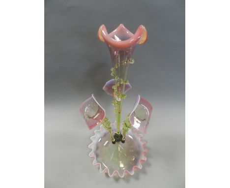 A late Victorian vaseline type glass epergne, having three trumpets around a central trumpet above a fluted base 