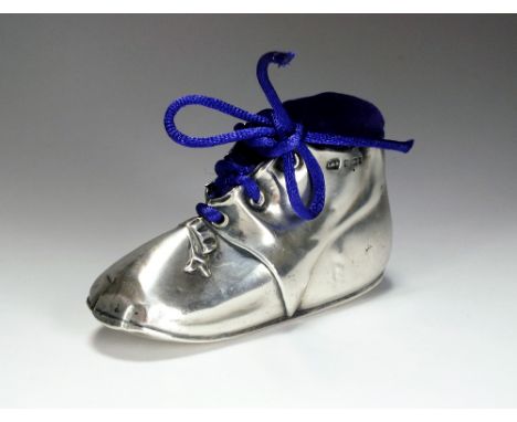 An Edwardian novelty silver pin cushion in the form of a shoe, Levi & Salaman, Birmingham 1906, 8.5cm wide