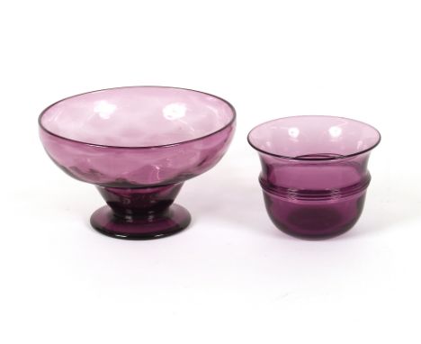 An amethyst glass bowl with ribbed central band and a similar fruit bowl on pedestal foot