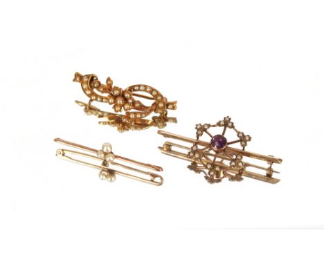 An Edwardian 9 carat gold bow brooch, set with seed pearls; a 9 carat gold bar brooch, set with three small seed pearls; and 