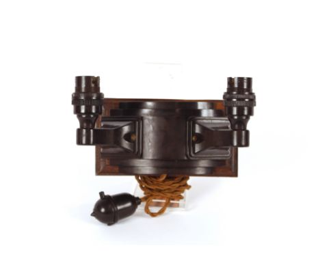 An Art Deco design Bakelite twin branch wall light 