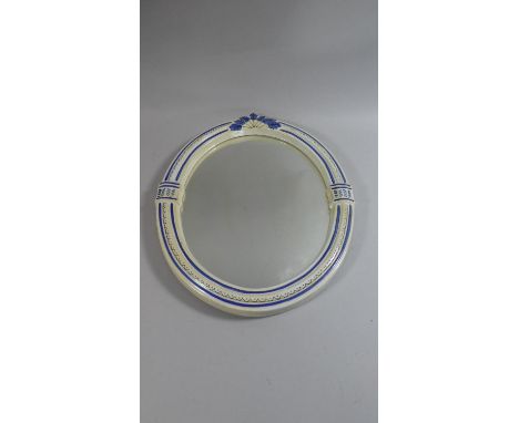 A Ceramic Framed Oval Wall Mirror, 40cm High 