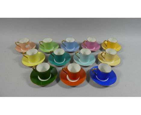 A Harlequin Set of Twelve Limoges Coffee Cans and Saucers 