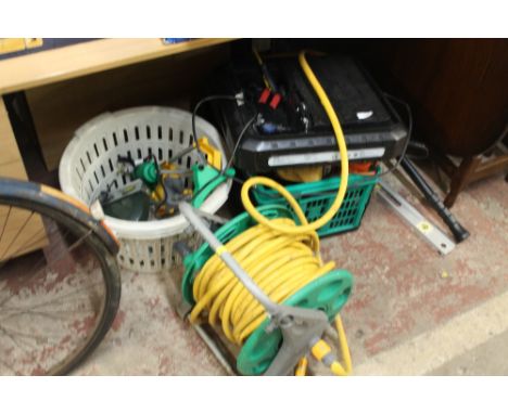 A QUANTITY OF TOOLS TOGETHER WITH A HOSE PIPE