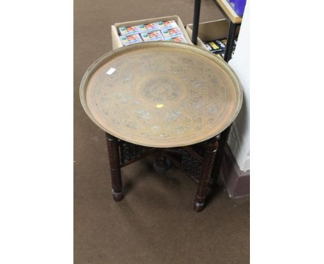 A BRASS TOP COFFEE TABLE