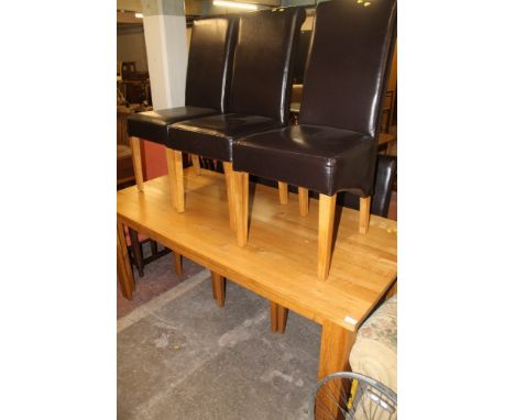 A LARGE MODERN DINING ROOM TABLE AND SIX CHAIRS