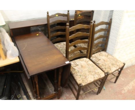 AN OAK DROP LEAF TABLE AND FOUR CHAIRS