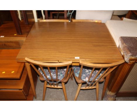 A TEAK DINING ROOM TABLE AND FOUR CHAIRS
