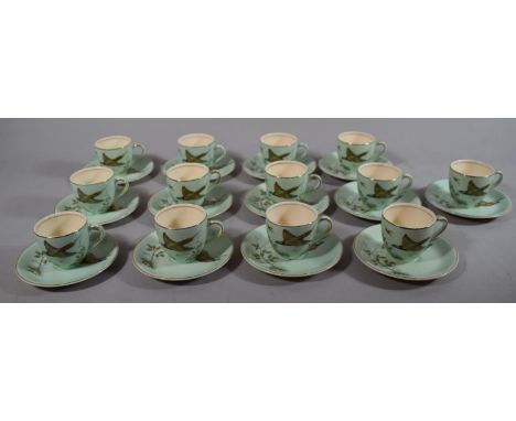 A Set of 13 Coffee Cans and Saucers by Meakin, Pheasant Pattern 