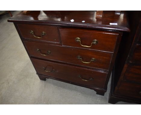 An early 20th Century mahogany chest of drawers in the Georgian style, having drop handles and bracket feet, in the Georgian 