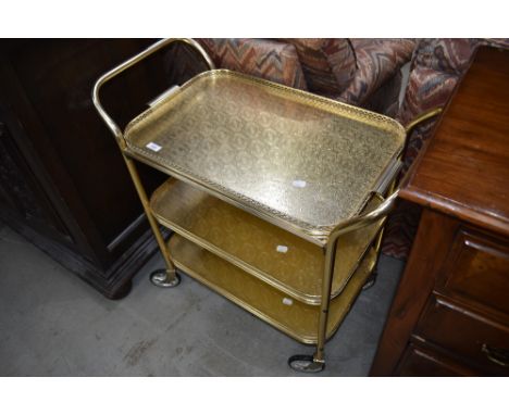 A vintage brass effect (probably aluminium) tea trolley