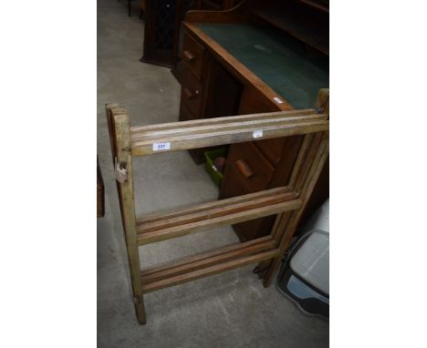 A vintage wooden clothes maid, triple section
