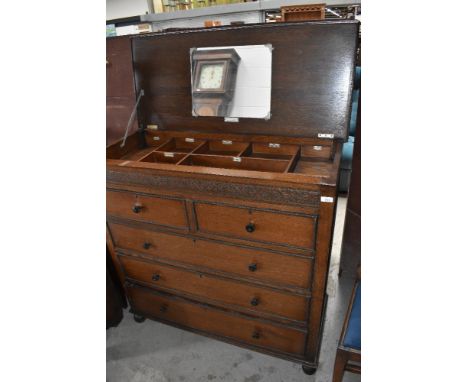 A vintage oak 'handy Chest' having fitted interior section bearing labels, patent number 204828