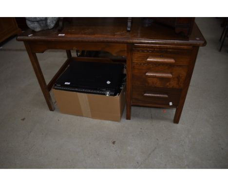 A vintage oak desk of small proportions, labelled Abess
Dimensions approx. W107cm D61cm H63cm