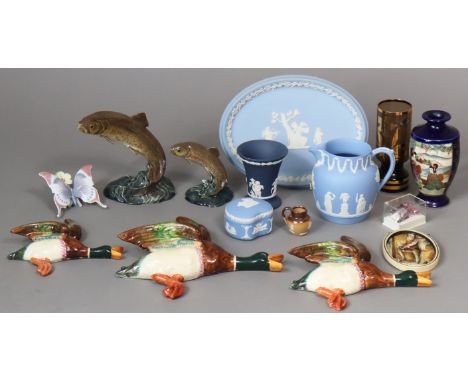 Two Beswick models of leaping trout (Nos 1032 and 1390); a Lladro butterfly ornament; a set of three graduated duck wall orna