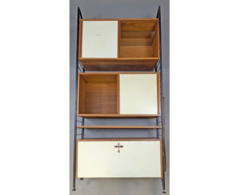A Staples Ladderax teak &amp; white-laminate interchangeable wall unit, fitted with three cupboards &amp; one shelf.