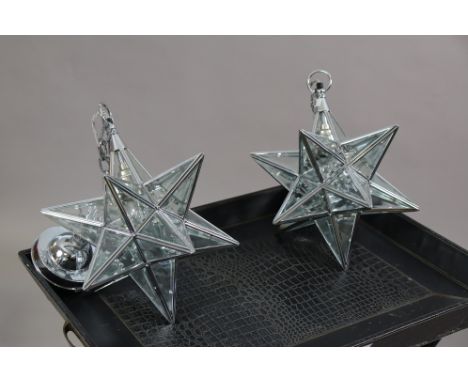A pair of modern star-shaped pendant ceiling light fittings, 29cm wide; &amp; an ebonised butlers-tray with stand.