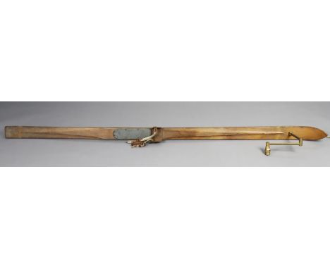 A 20th century novelty wall light adapted from a vintage ski, with adjustable angled brass arm, 197cm long.