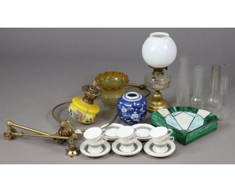 A brass oil table lamp with a clear glass reservoir, &amp; with white opaque glass shade; a brass ceiling light fitting; a bl