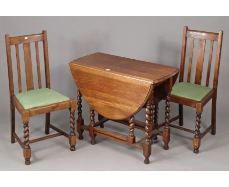A 1930’s oak oval gate-leg dining table on barley-twist legs, turned feet, &amp; with plain stretchers, 90cm wide x 71cm high