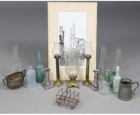 A pair of Sheffield plated candlesticks, 13cm high; a silver plated four-division toast rack; five vintage glass bottles; a p