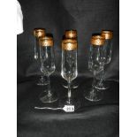 A set of six champagne flutes.