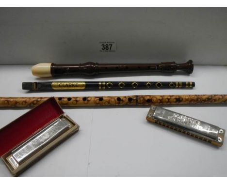 Two harmonica's, two whistles and a recorder. 