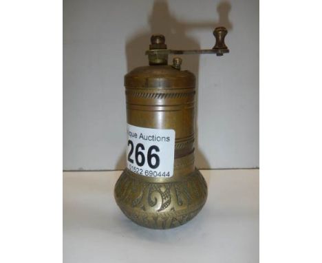 An old brass pepper grinder.