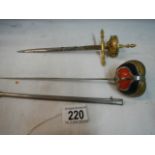 Two sword shaped letter openers (one with scabbard).