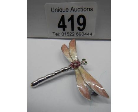 An enamel dragonfly brooch.