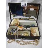 A jewellery box with assorted costume jewellery including cameo.