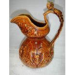 A good early 20th century crackle glaze jug with figural handle.