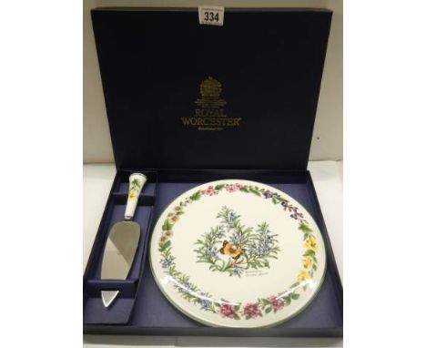 A boxed Royal Worcester porcelain cake plate with cake slice. 