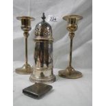A pair of silver plate candlesticks, sugar sifter and match box.