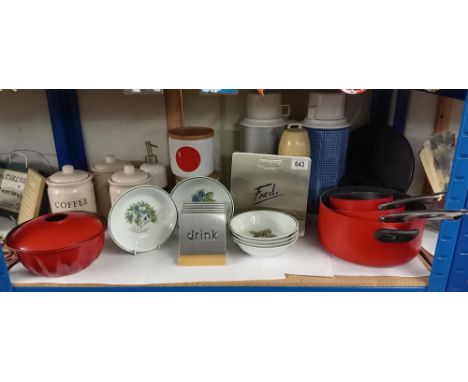 A Shelf full of kitchen items, pans etc 