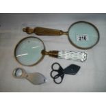 Two 20th century magnifying glasses and two others.