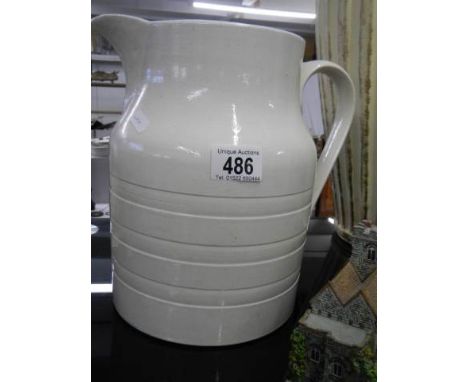 A large ceramic jug. 
