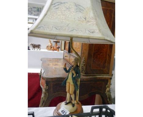 A figural table lamp. 