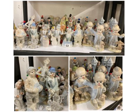 A good collection of ceramic and resin clown figures 