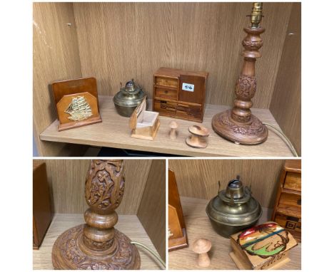 A selection of treen items including a carved lamp base and brass lamp base 