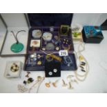An unusual jewellery box with a mixed lot of costume jewellery.