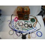 An jewellery box with a mixed lot of costume jewellery.